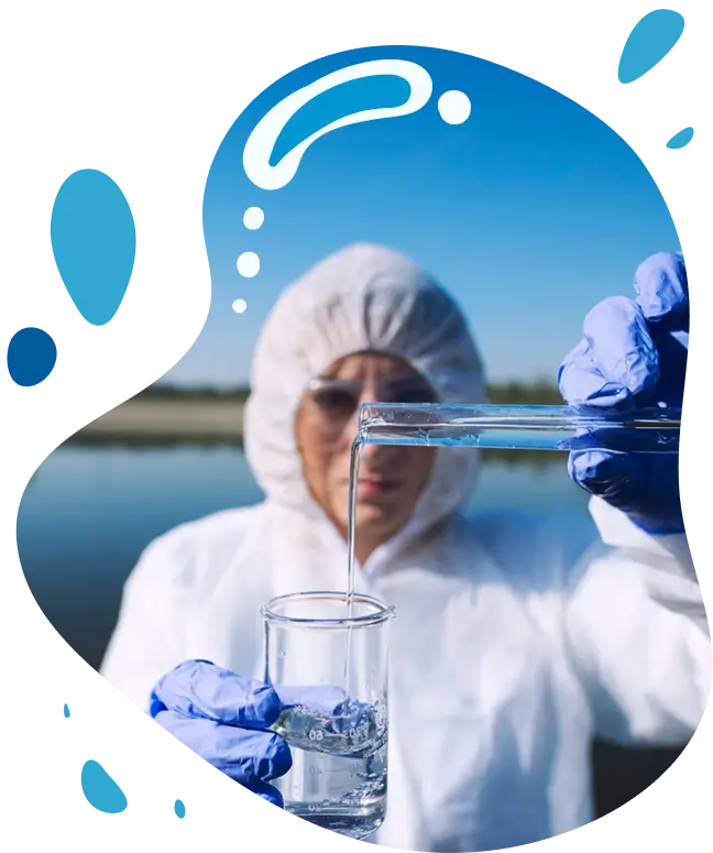 Lab technician wearing PPE pouring water sample into glass, representing science-backed hydrogen water benefits